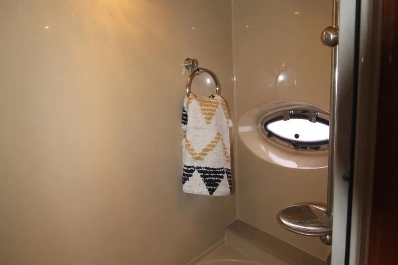 Slide: The Image of Bathroom interior of 2004 Cruisers Yachts 405 Express Motoryacht with towel and porthole. - 40