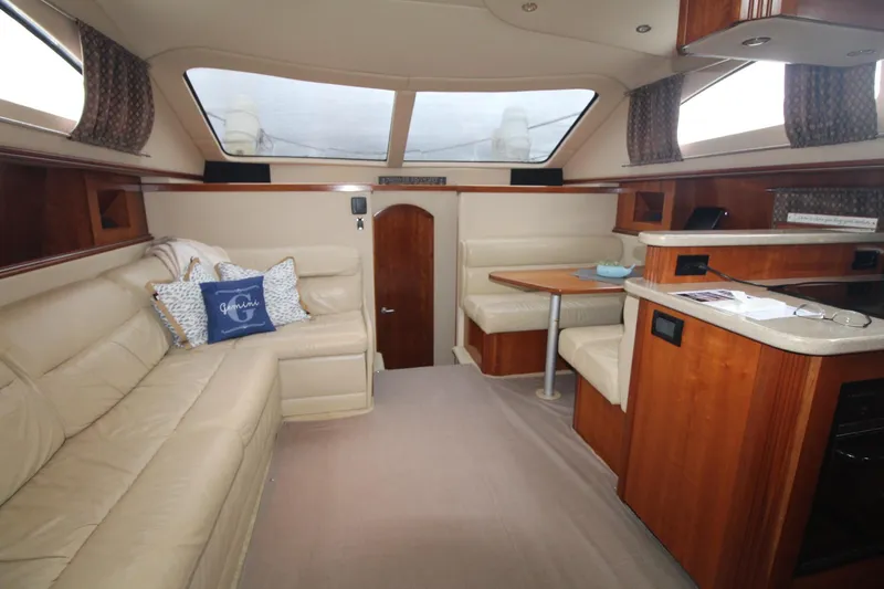 Slide: The Image of Luxurious interior of 2004 Cruisers Yachts 405 Express Motoryacht with plush seating and dining area. - 45