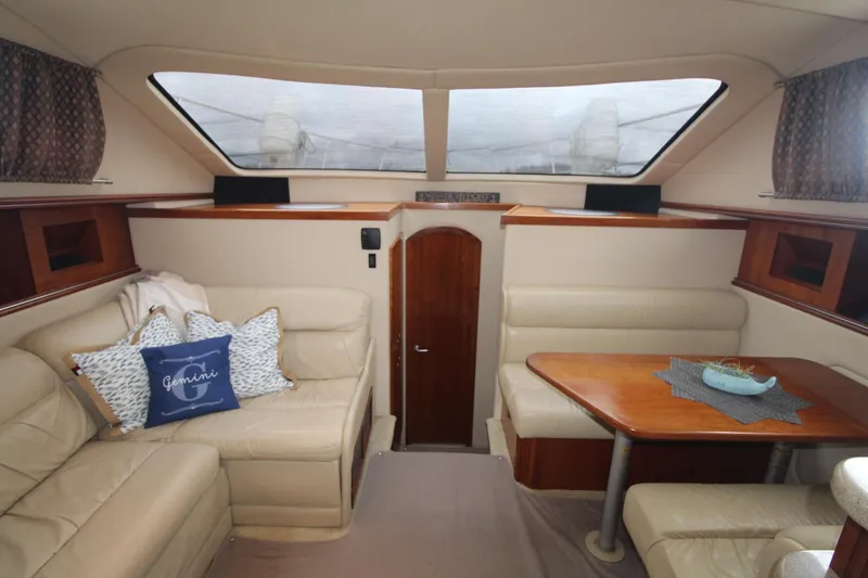 Slide: The Image of Luxurious interior of 2004 Cruisers Yachts 405 Express Motoryacht with plush seating and dining area. - 46