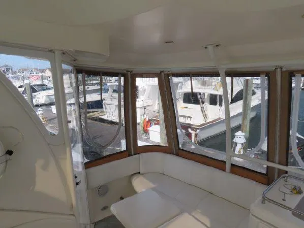 Slide: The Image of 2004 Cruisers Yachts 405 Express Motoryacht interior with marina view. - 8