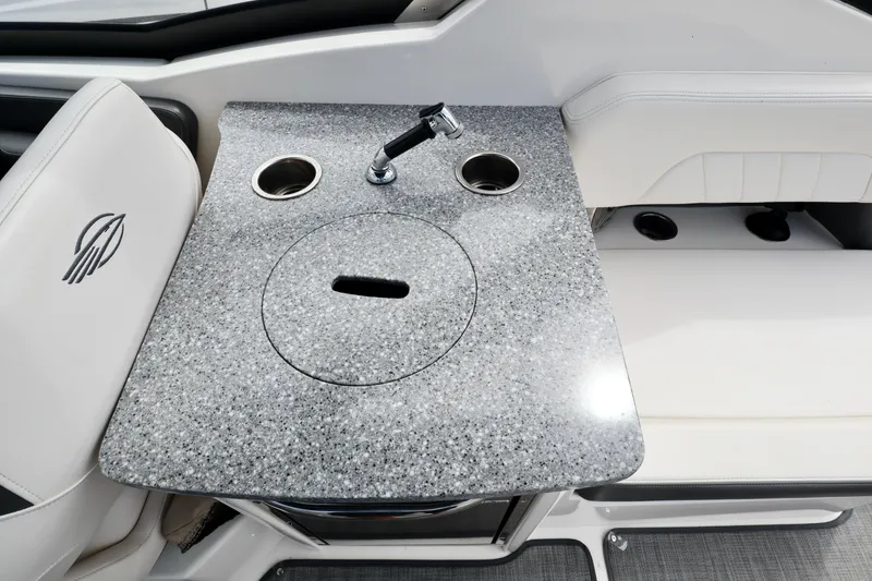 Slide: The Image of 2016 Chaparral 307 SSX boat interior with granite countertop and built-in sink. - 12