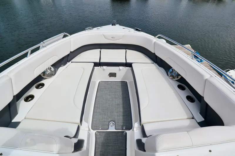 Slide: The Image of 2016 Chaparral 307 SSX boat interior with spacious seating and cup holders. - 2