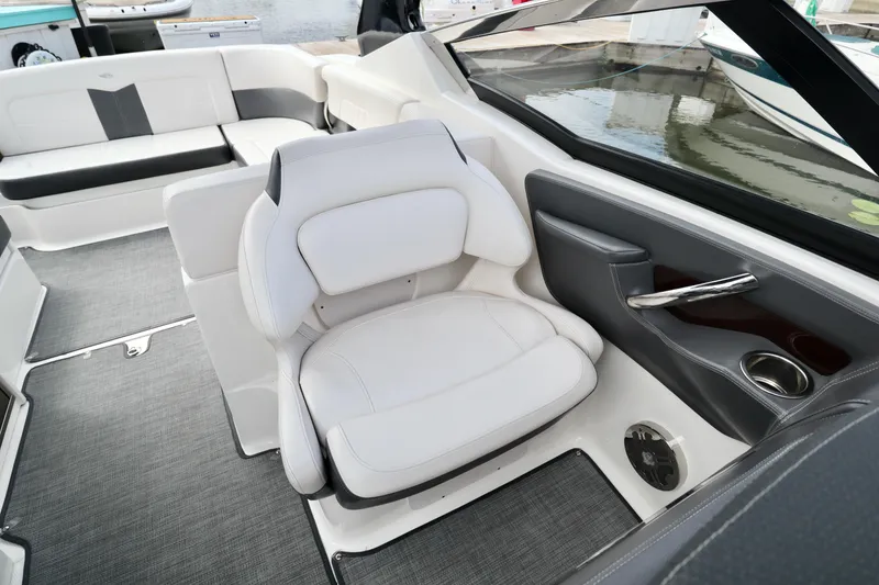 Slide: The Image of 2016 Chaparral 307 SSX boat interior with white seating and modern design. - 27