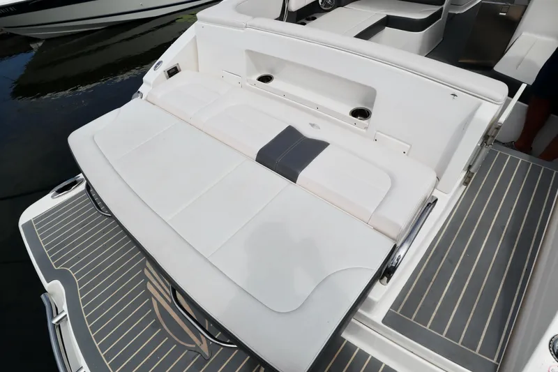 Slide: The Image of 2016 Chaparral 307 SSX boat with spacious rear seating and sleek deck design. - 30