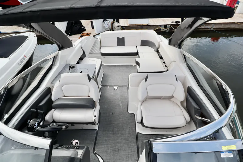 Slide: The Image of 2016 Chaparral 307 SSX boat interior with luxurious seating and sleek design. - 33