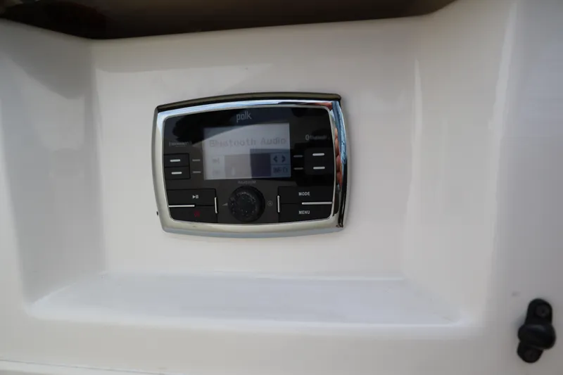 Slide: The Image of Polk Bluetooth audio system on 2016 Chaparral 307 SSX boat dashboard. - 34