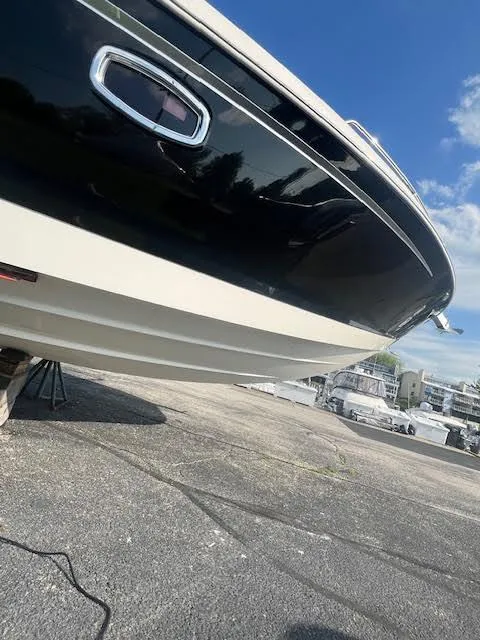 Slide: The Image of 2016 Chaparral 307 SSX boat on dry dock under clear blue sky. - 35