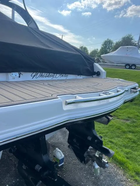 Slide: The Image of 2016 Chaparral 307 SSX boat with covered deck and dual propellers. - 41