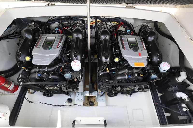 Slide: The Image of 2016 Chaparral 307 SSX boat engine compartment with dual powerful engines. - 8