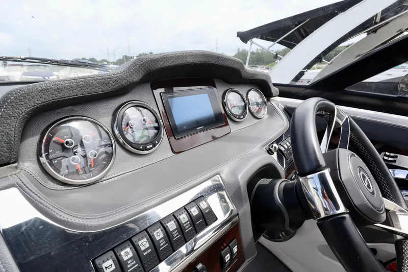 Slide: The Image of 2016 Chaparral 307 SSX dashboard with gauges and steering wheel. - 9