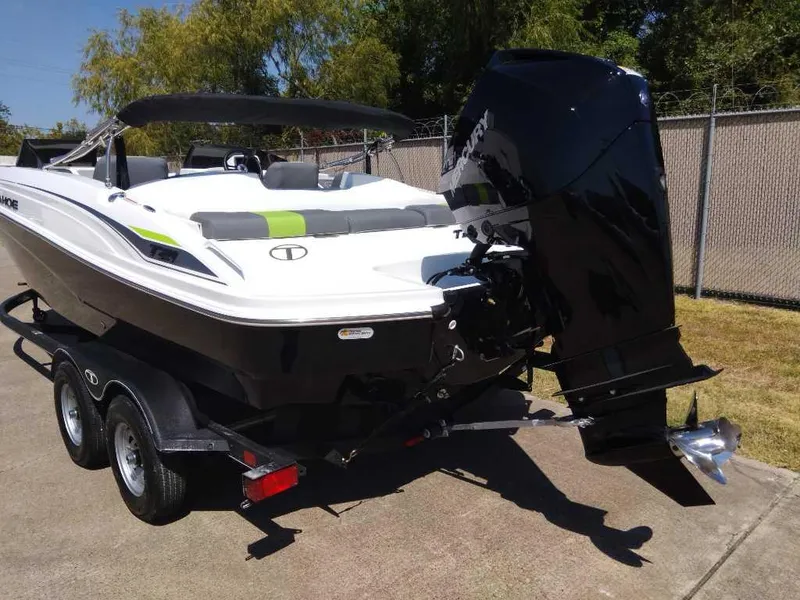 Slide: The Image of 2024 Tahoe T21 boat on trailer with outboard motor. - 4