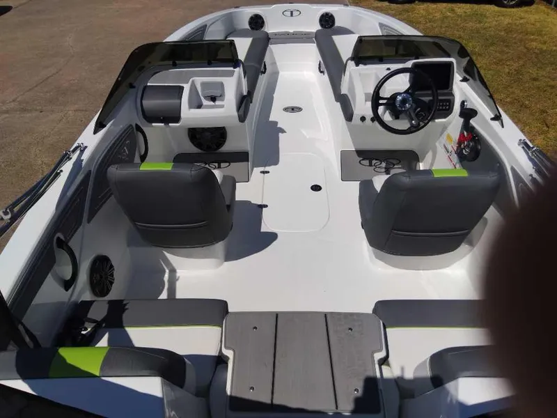 Slide: The Image of 2024 Tahoe T21 boat interior with dual consoles and modern seating. - 5