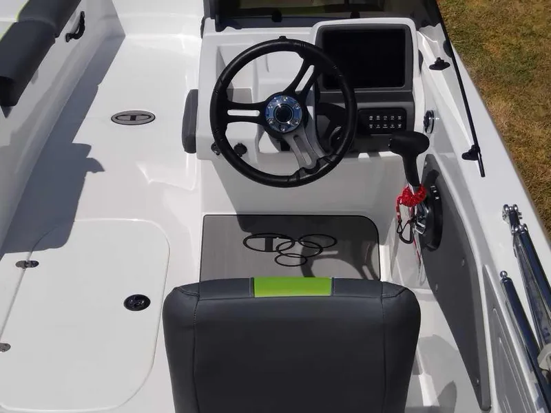Slide: The Image of 2024 Tahoe T21 boat cockpit with steering wheel and control panel. - 6
