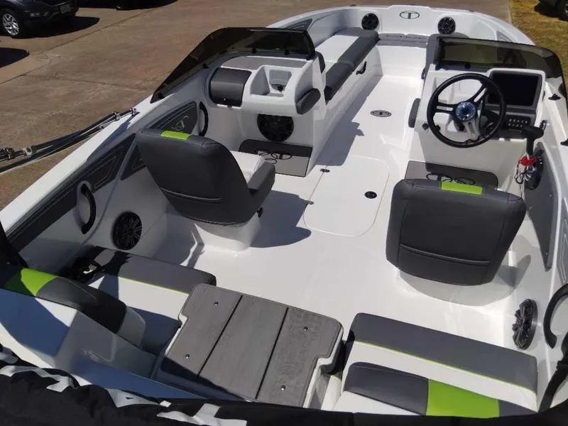 Slide: The Image of 2024 Tahoe T21 boat interior with modern seating and steering console. - 7