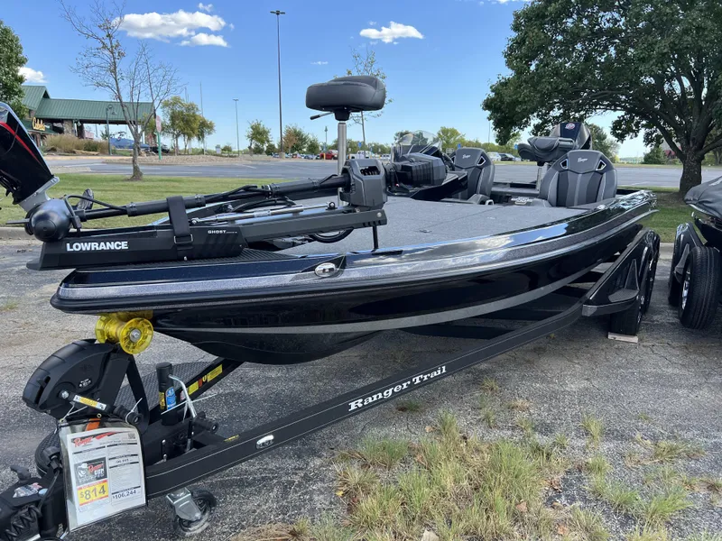 Slide: The Image of 2024 Ranger Z521R Ranger Cup Equipped boat on trailer in outdoor setting. - 2