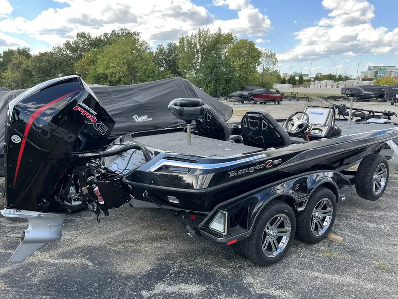 Slide: The Image of 2024 Ranger Z521R Ranger Cup Equipped boat, black, parked outdoors. - 3