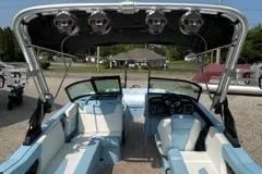 Slide: The Image of 2023 MasterCraft NXT22 boat interior with seating and control panel. - 7