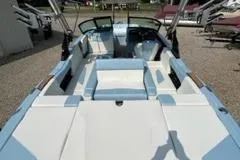Slide: The Image of 2023 MasterCraft NXT22 boat interior with white and blue seating. - 8