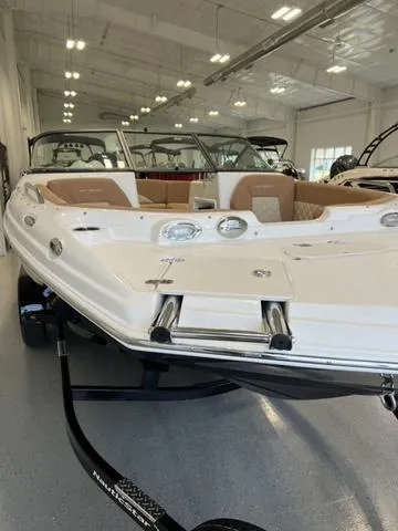 Slide: The Image of 2024 NauticStar 203 DC boat in showroom, front view. - 4
