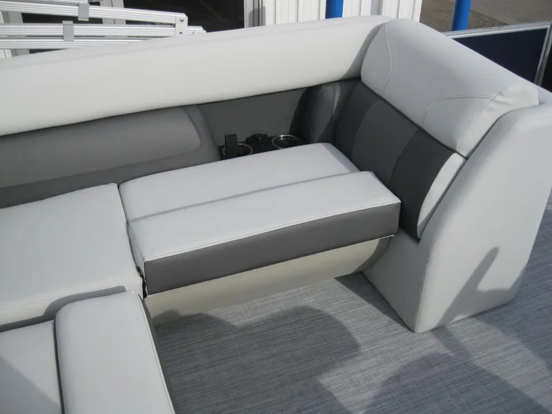 Slide: The Image of 2023 Harris FloteBote Cruiser 230 interior seating with gray and white upholstery. - 10