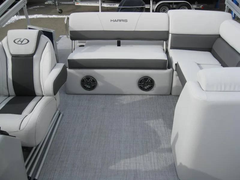 Slide: The Image of 2023 Harris FloteBote Cruiser 230 interior with white and gray seating. - 11
