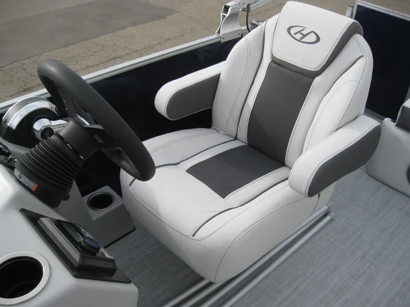 Slide: The Image of Captain's chair of 2023 Harris FloteBote Cruiser 230 pontoon boat, featuring ergonomic design and premium materials. - 12