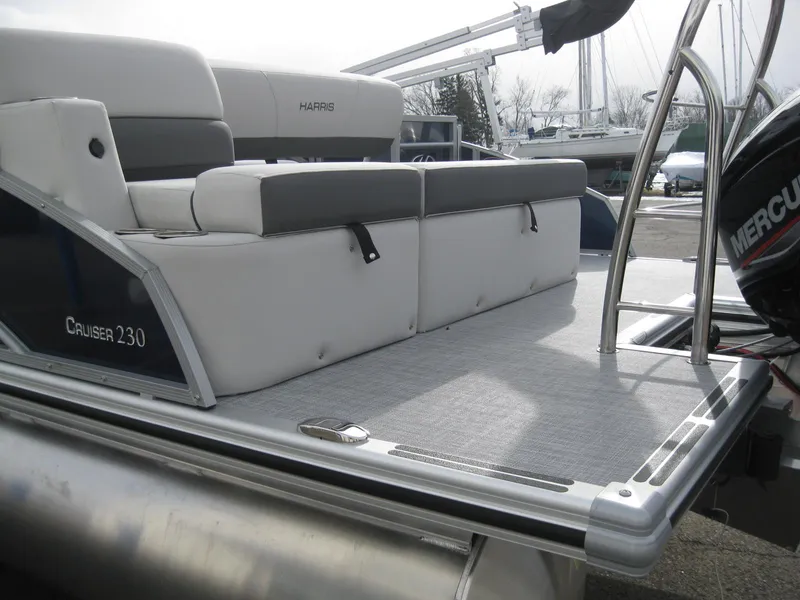Slide: The Image of 2023 Harris FloteBote Cruiser 230 pontoon boat with comfortable seating and modern design. - 7