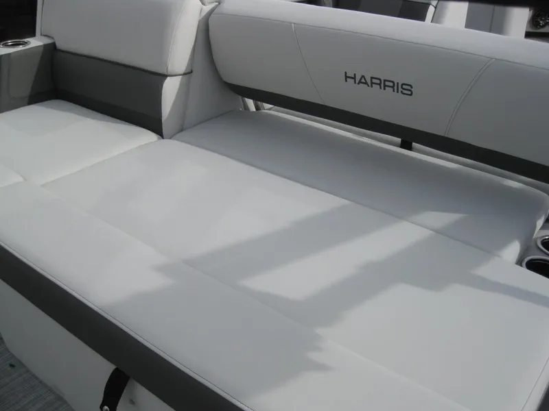 Slide: The Image of 2023 Harris FloteBote Cruiser 230 boat seating with white and gray upholstery. - 8