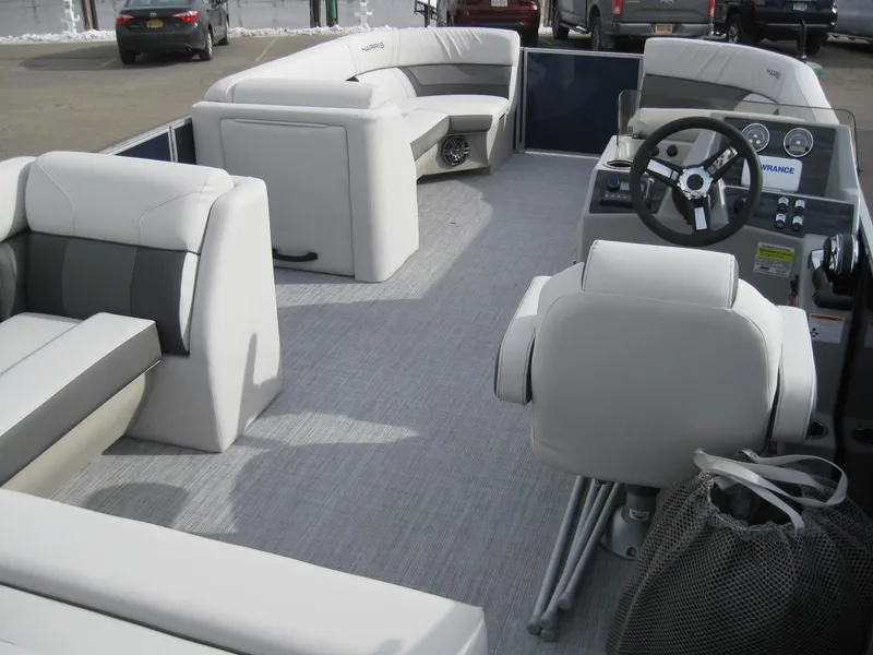 Slide: The Image of 2023 Harris FloteBote Cruiser 230 interior with plush seating and modern helm. - 9