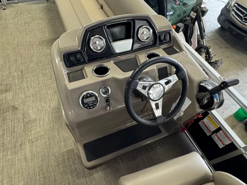 Slide: The Image of 2021 Ranger 200C boat dashboard with steering wheel and gauges. - 11