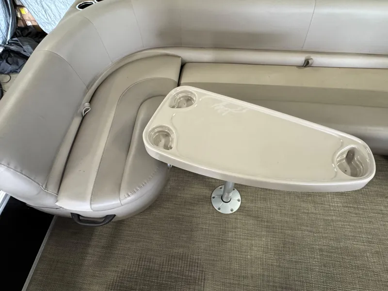 Slide: The Image of Beige seating area with table on a 2021 Ranger 200C boat. - 14