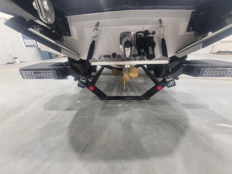 Slide: The Image of 2024 MasterCraft XT24 boat stern with propeller and swim platform. - 20