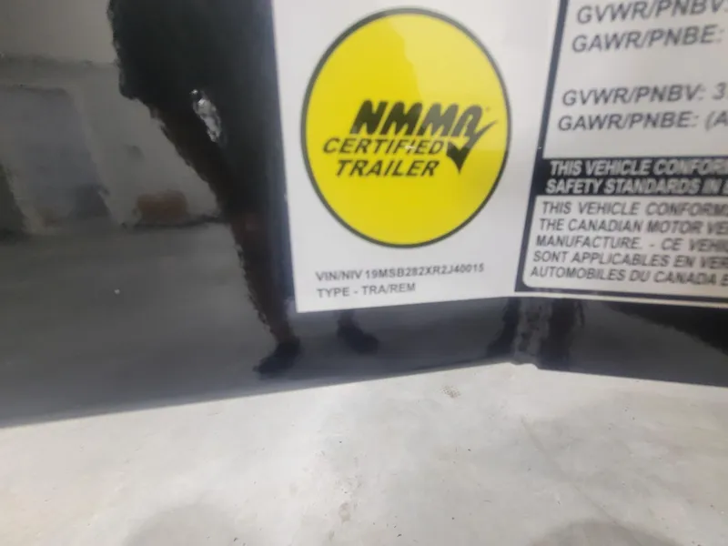 Slide: The Image of 2024 MasterCraft XT24 NMMA Certified Trailer label with VIN and safety standards. - 25