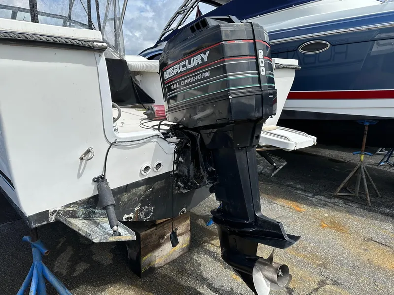 Slide: The Image of 1994 Robalo 2160 Cuddy Cabin with Mercury outboard motor. - 4