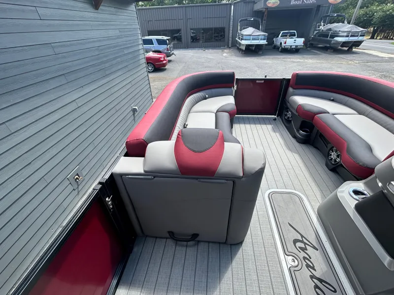 Slide: The Image of 2024 Avalon LSZ 2385 CRB pontoon boat interior with red and gray seating. - 13