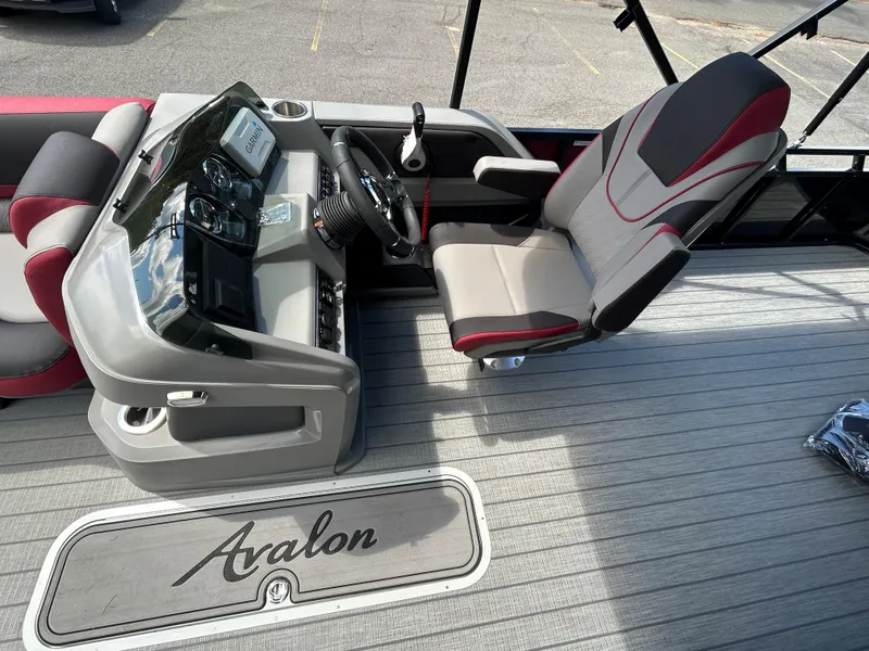 Slide: The Image of 2024 Avalon LSZ 2385 CRB boat interior with captain's chair and control console. - 15