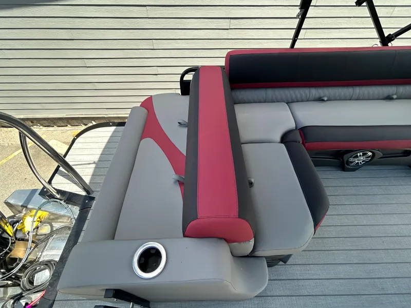 Slide: The Image of 2024 Avalon LSZ 2385 CRB boat interior with red and gray seating. - 19