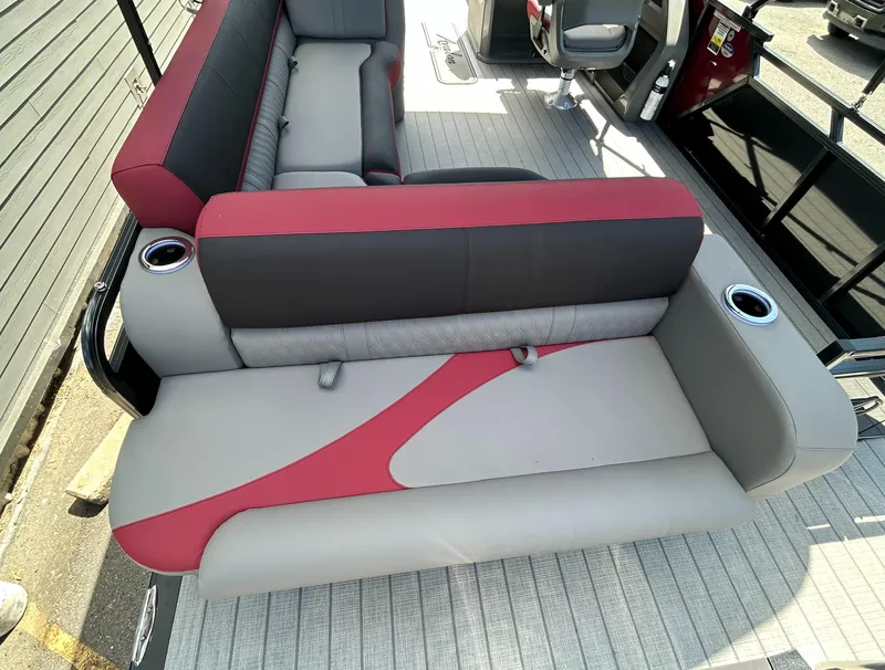 Slide: The Image of 2024 Avalon LSZ 2385 CRB boat interior with red and gray seating. - 20