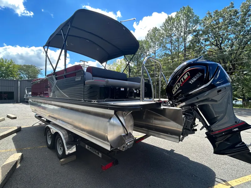 Slide: The Image of 2024 Avalon LSZ 2385 CRB pontoon boat with Yamaha engine on trailer. - 5