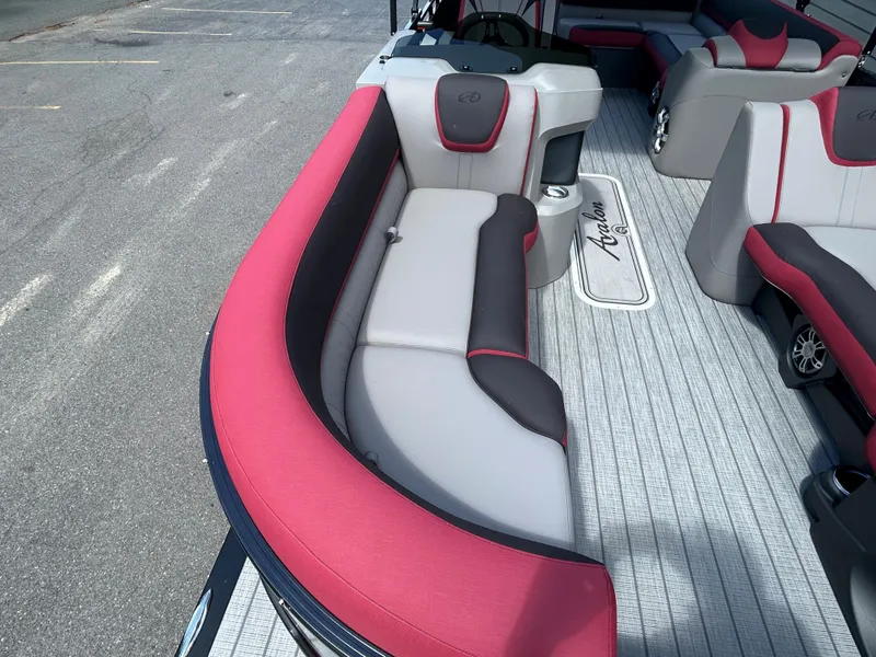 Slide: The Image of 2024 Avalon LSZ 2385 CRB pontoon boat with red and gray seating. - 9