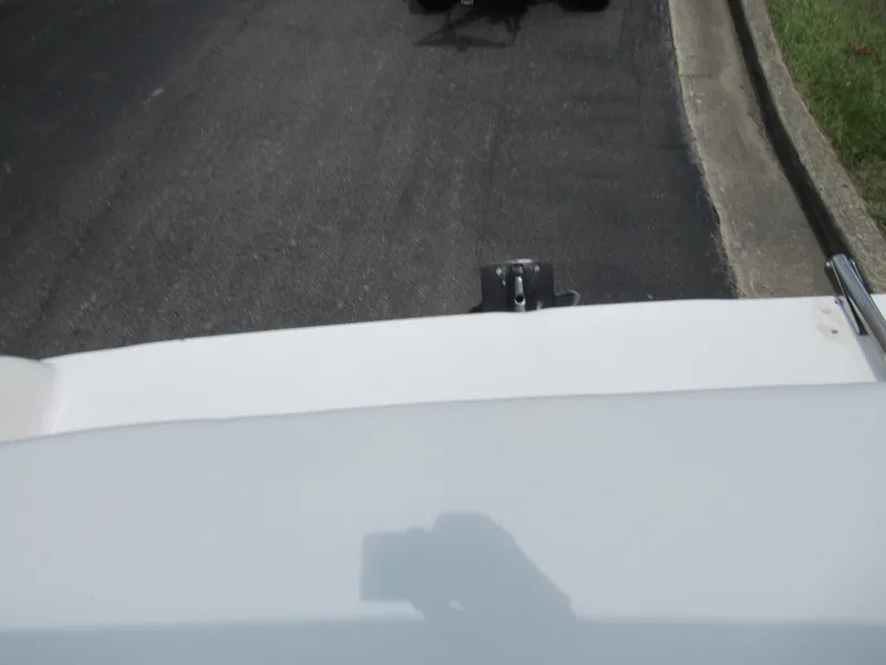 Slide: The Image of 1997 Sea Ray 185 Bow Rider boat on a trailer, close-up view. - 23