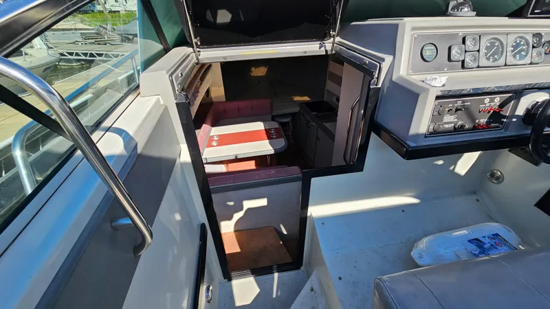 Slide: The Image of 1988 Formula 26 PC boat interior with cabin and control panel. - 13