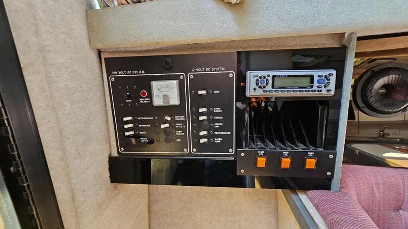Slide: The Image of 1988 Formula 26 PC control panel with switches and radio. - 23