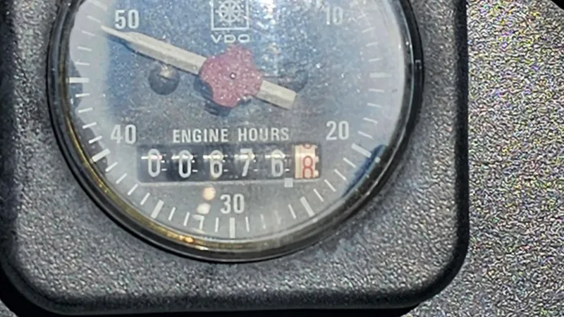 Slide: The Image of Close-up of engine hours gauge on 1988 Formula 26 PC boat showing 676.8 hours. - 25
