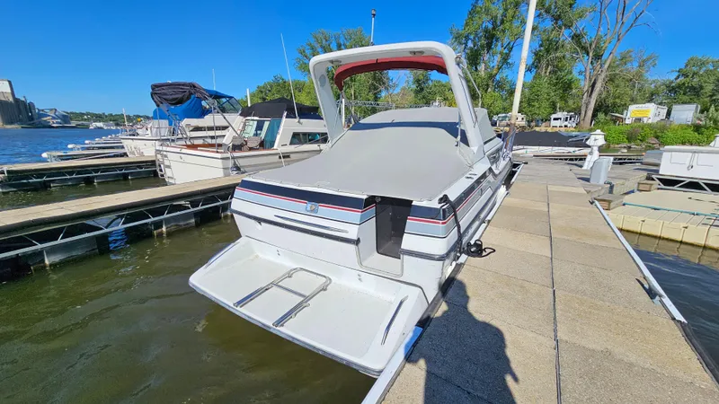 Slide: The Image of 1988 Formula 26 PC boat docked at marina on a sunny day. - 3