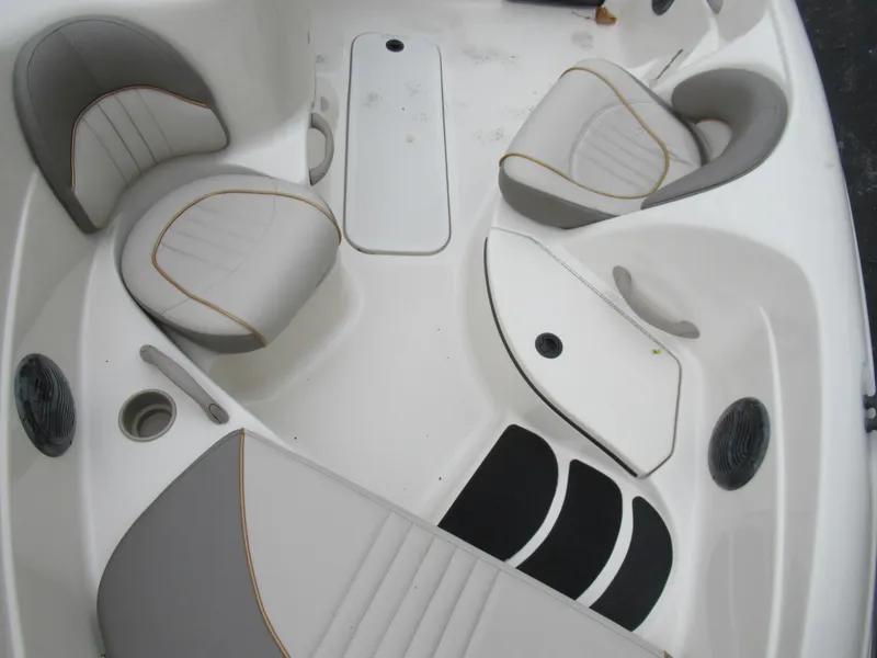 Slide: The Image of 2004 Sugar Sand Tango Xtreme boat interior with white and gray seating. - 13