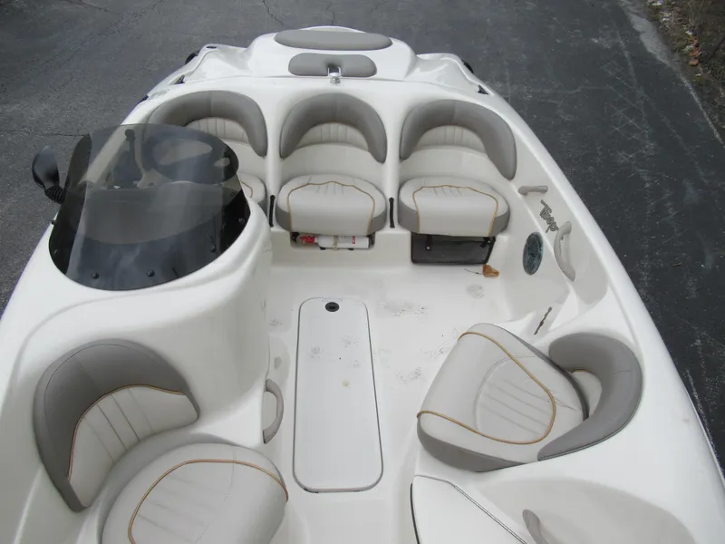 Slide: The Image of 2004 Sugar Sand Tango Xtreme boat interior with seating and dashboard. - 14