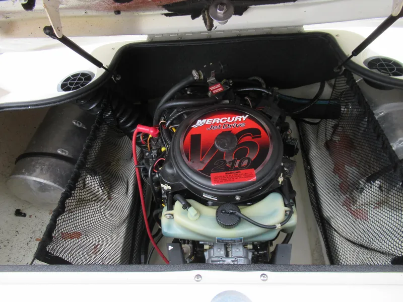 Slide: The Image of 2004 Sugar Sand Tango Xtreme boat engine compartment with Mercury V6 210 engine. - 18