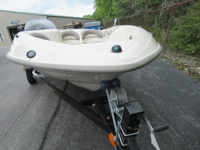 Slide: The Image of 2004 Sugar Sand Tango Xtreme boat on a trailer in a parking lot. - 5