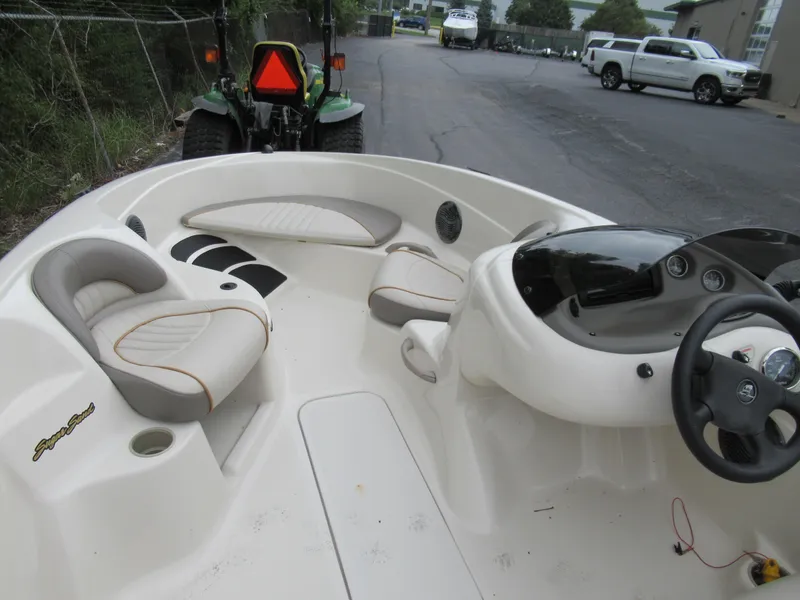 Slide: The Image of 2004 Sugar Sand Tango Xtreme boat interior with seating and steering console. - 9